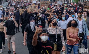 A group of people walking in front of a crowd

Description automatically generated