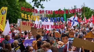 A group of people holding signs

AI-generated content may be incorrect.